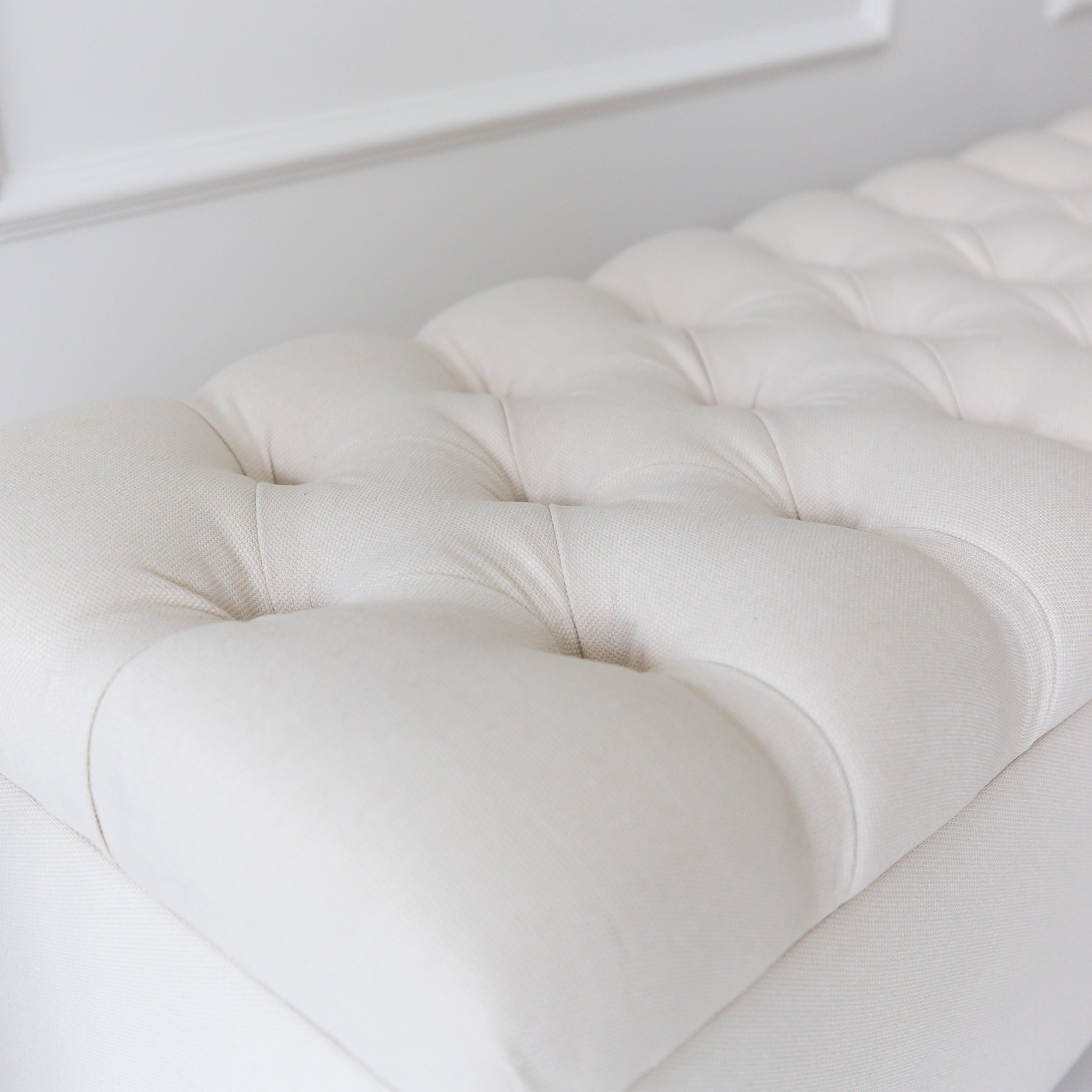 Ivory Upholstered Storage Ottoman with Metal Studs