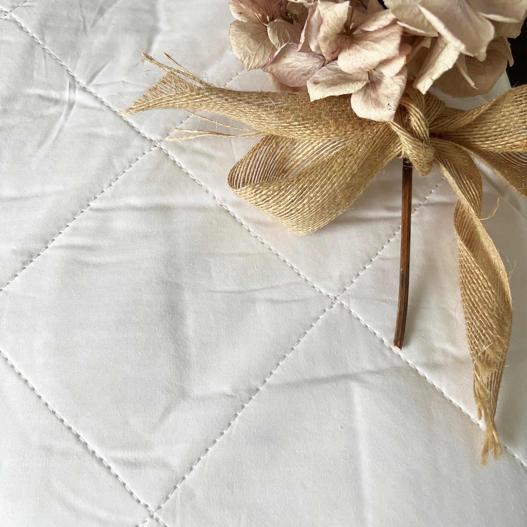 white quilted protector 